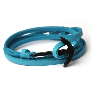 Macro shot of blue leather braided multi-layer bracelet with black anchor clasp