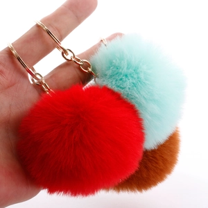 Set of 7cm fluffy faux rabbit fur keychains in red, teal and brown with gold rings
