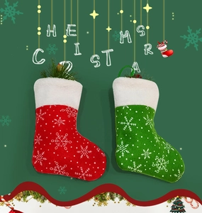 Detail of red and green Christmas stockings with snowflake patterns and white faux fur trim