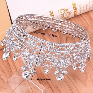 Detail view of silver rhinestone bridal crown with heart patterns, 13.5cm wide and 7cm high