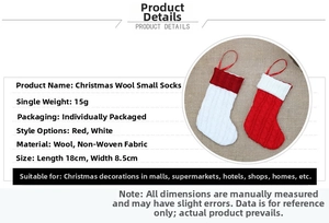 Detail of red and white knitted wool mini Christmas stockings for holiday decoration