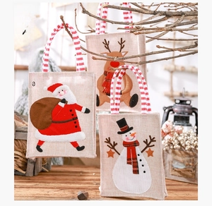 Three-piece burlap Christmas gift bags set with Santa, Reindeer and Snowman patterns