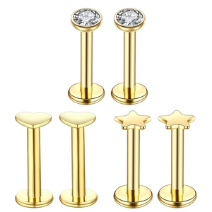 Gold stainless steel labret set featuring heart, star, and round zircon stud piercings
