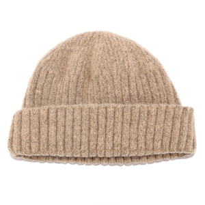 Close-up of light khaki rib-knit beanie showing detailed texture and warm wool blend