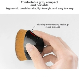 Ergonomic foundation brush detail showing comfortable grip and dense synthetic bristles