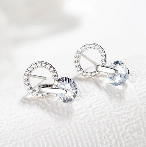Elegant silver round stud earrings with nested dual circles and sparkling cubic zirconia