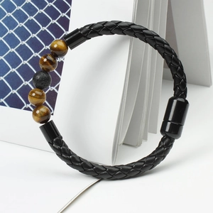 Detail of beaded leather bracelet with tiger eye stones and magnetic metal clasp