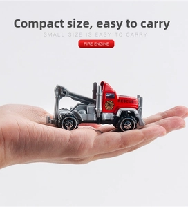 Close-up of a handheld mini alloy fire truck model showing its compact portable size