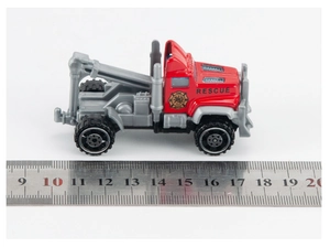 Detailed macro view showing the 9cm dimensions of the red rescue toy fire truck model