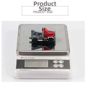 Detail of red alloy rescue fire truck toy on a digital scale showing lightweight 18.3g mass