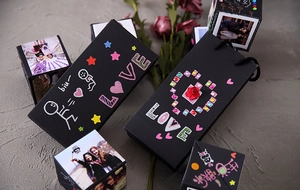 DIY surprise jumping photo box with black cardboard cubes and decorative heart stickers
