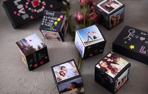 Macro detail of DIY black surprise jumping gift box with personalized photos and notes