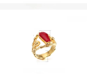 Gothic punk vampire coffin ring with golden skeleton arms and red resin inlay detail