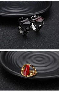 Detailed view of Gothic punk vampire coffin ring with red inlay in silver, gold and black