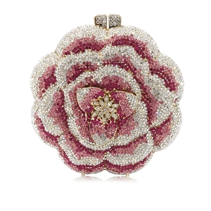 Detailed macro view of the 3D rose-shaped clutch with pink and white gradient rhinestones