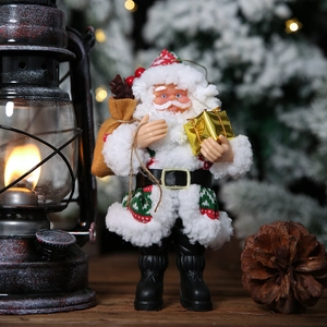 Standing Santa Claus figurine with red coat, gift bag and golden box for Christmas decor