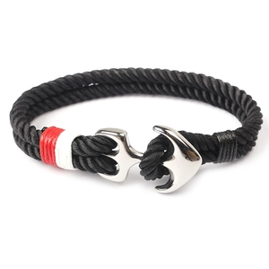 Handmade nautical anchor bracelet with black nylon rope and silver metal clasp detail