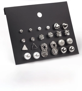 Detail view of 12-pair earring set with geometric shapes, pearls and rhinestones on card