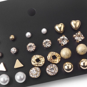 12-pair gold and pearl stud earrings set with geometric shapes and crystal accents