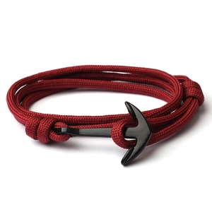 Handmade nautical multilayer braided nylon bracelet with black anchor clasp on white background