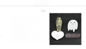 Detail of gothic enamel pins featuring skull, coffin and ghost in zinc alloy finish