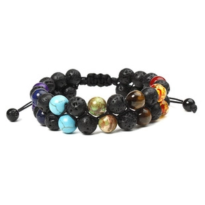 Detail of adjustable woven cord and natural lava tiger eye beads on double-layer bracelet