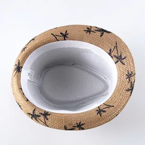 Classic straw sun hat with palm tree print and sweatband for beach vacation and sun protection