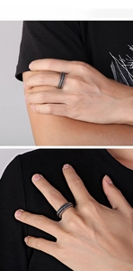 Detail view of double woven vintage chain ring with oxidized finish on finger