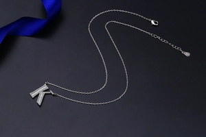 Detailed close-up of S925 sterling silver letter K pendant necklace with pave-set zircons