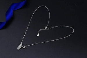 Detail view of silver S925 sterling silver V-letter pendant necklace with sparkling cubic zirconia