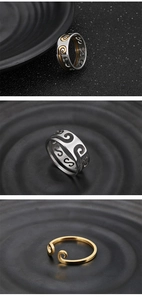Detailed macro view of vintage silver and gold rings with intricate spiral patterns