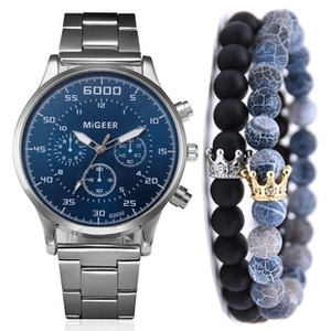 Detail of silver quartz watch with blue square dial and beaded crown bracelets set
