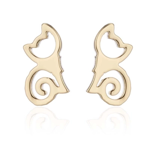 Close-up of golden hollowed cat stud earrings with reflective surface on white background
