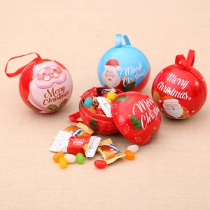 Festive Christmas tin candy jars featuring Santa Claus and tree motifs for holiday gifts