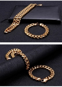 Detail shot of luxury gold Cuban chain necklace and bracelet set on a dark background