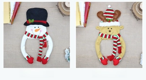 Detail of Christmas tree topper felt snowman and reindeer decor with soft brushed fabric