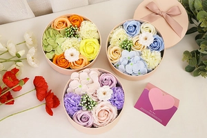 Soap flower gift boxes in vibrant colors with a romantic English greeting card