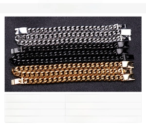 Detail view of gold, black and steel cuban link chains weighing 185g in stainless steel
