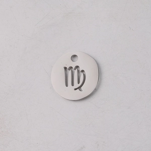 Macro shot of 12mm silver stainless steel Virgo zodiac round pendant for DIY jewelry