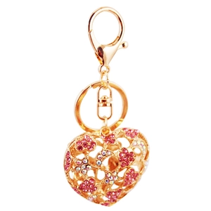 Golden heart-shaped keychain with pink rhinestones and a lobster clasp on white background