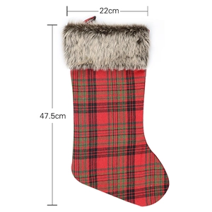 Classic red and green plaid Christmas stocking with fur trim measuring 22cm by 47.5cm