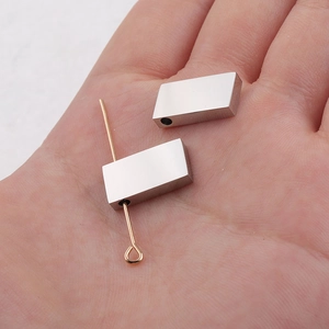 Polished stainless steel rectangular spacer beads on palm for size reference diy jewelry