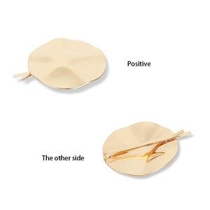 Detailed front and back views of a metallic gold geometric hair clip with a textured surface