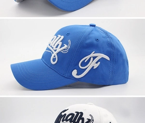 Detail view of 3D white embroidery text on blue and white cotton twill baseball caps