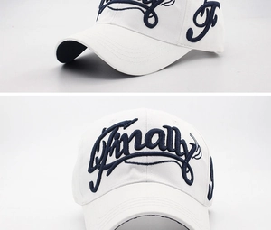 Detailed close-up of blue 'Finally' embroidery on a premium white cotton baseball cap