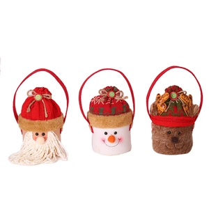 Three Christmas knitted gift bags featuring Santa, Snowman, and Reindeer motifs