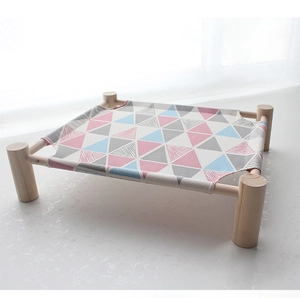 Detail of wooden pet hammock with removable geometric pattern canvas for cats and small dogs