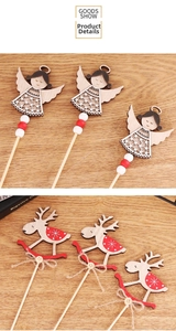 Detailed view of laser-cut wooden Christmas toppers with angel and reindeer shapes