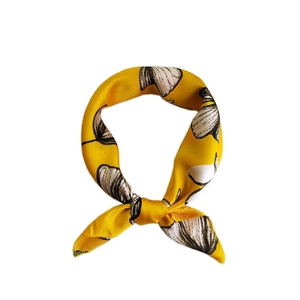 Elegant yellow silk scarf featuring black and white shell patterns for women accessory