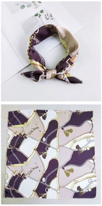 Detail of a square silk scarf with purple chain and horse bit patterns on white background